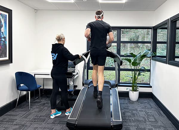 A customer standing ready for a 3d body scan